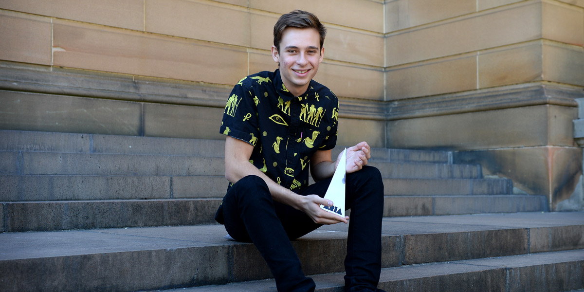 Flume poses after winning four ARIA awards. Photo: AAP