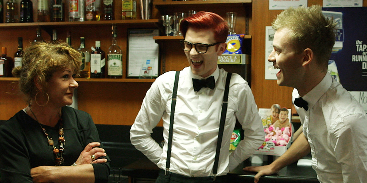 Rhys Nicholson and Joel Creasey working behind the bar at the Colac pub. Photo: ABC