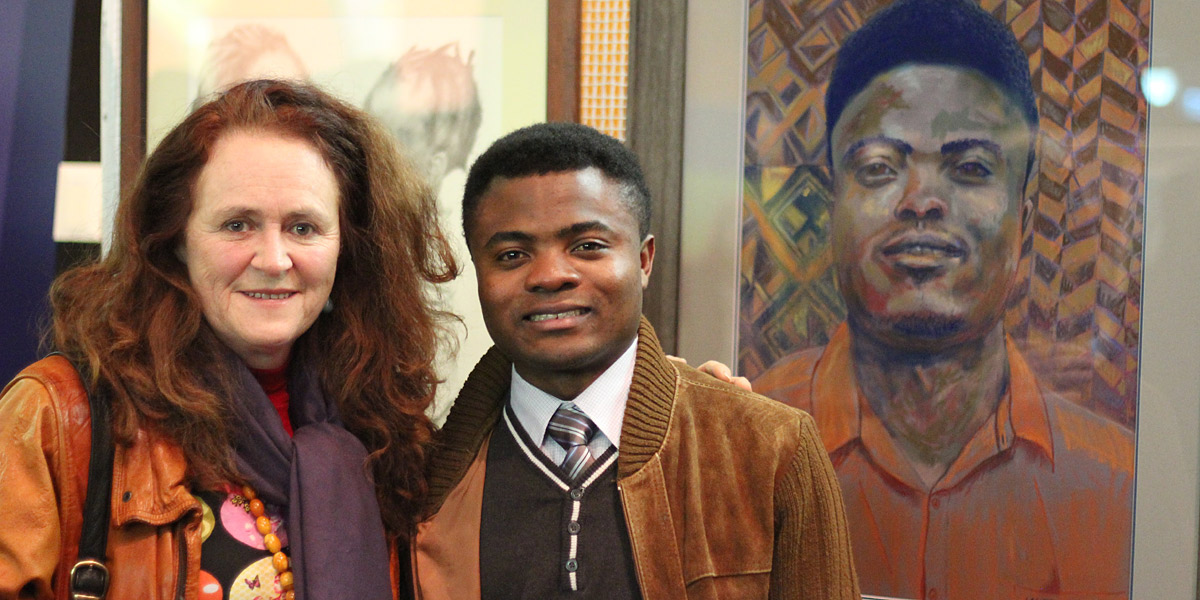 Lauryn Arnott with refugee Safari Bahizire and her portait of him.