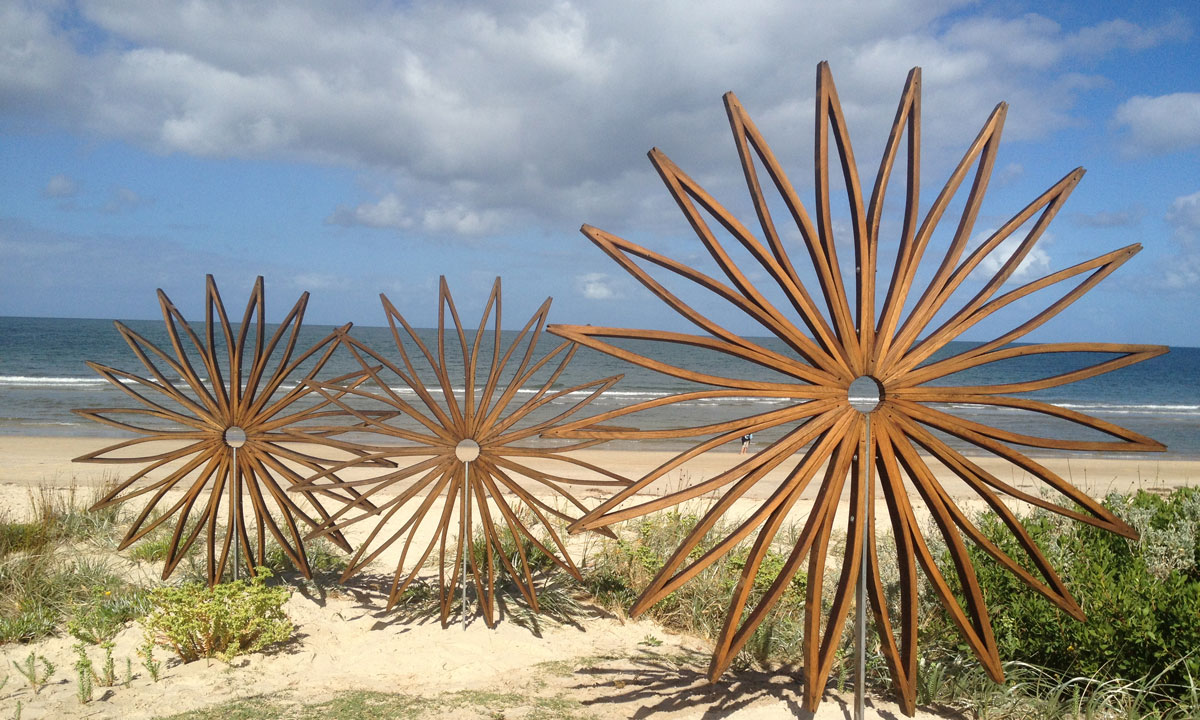 'The Sunflowers', by Quentin Gore, made of upcycled French oak wine barrel staves. It is part of the Brighton Jetty Classic Sculptures Exhibition.