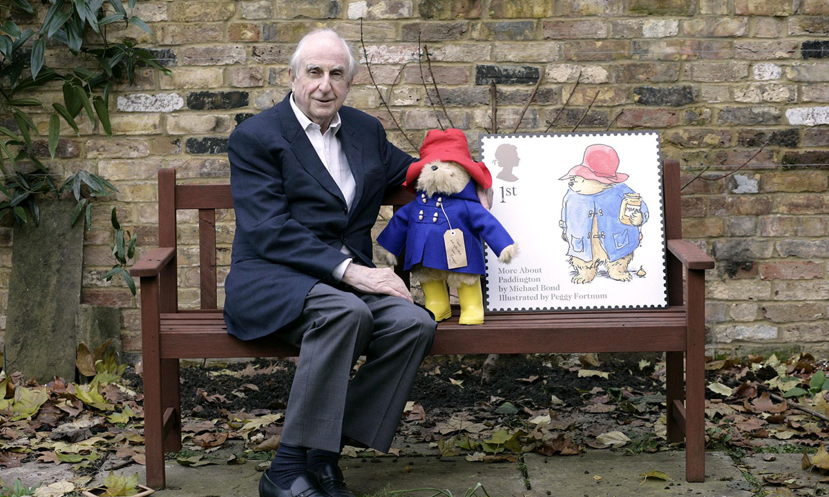 Michael Bond with Paddington Bear in 2006, when he appeared on the Royal Mail's 1st class stamp. Photo: PA