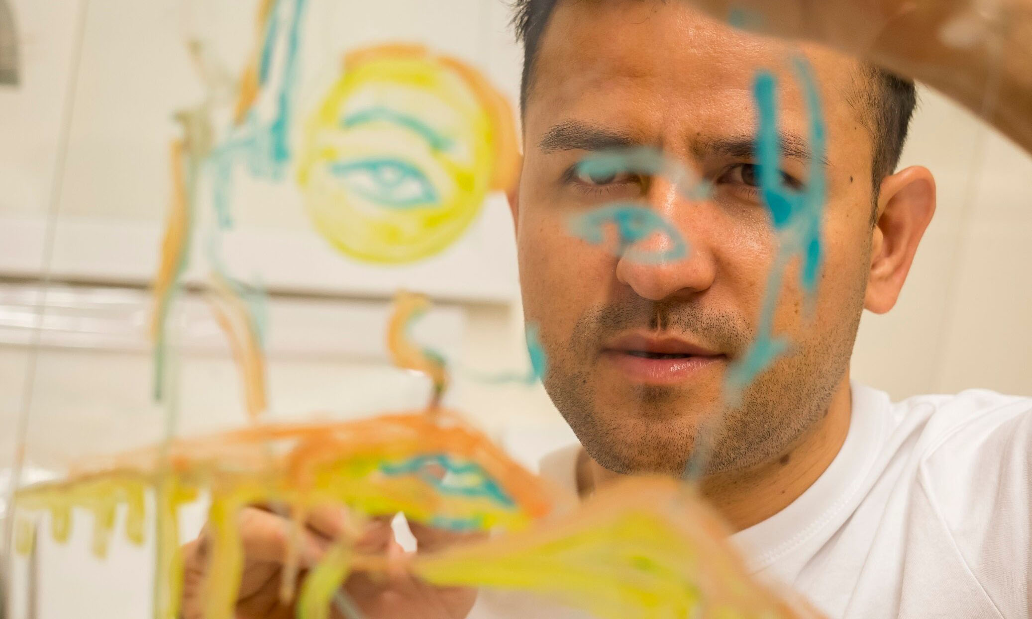 Artist Elyas Alavi at work. Photo: Sam Robert