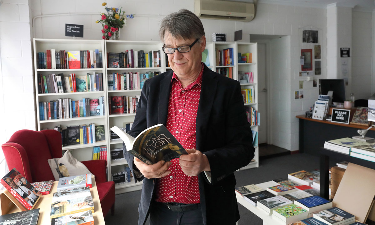 Wakefield Press publisher Michael Bollen with new novel Long Flight Home. Photo: Tony Lewis / InDaily
