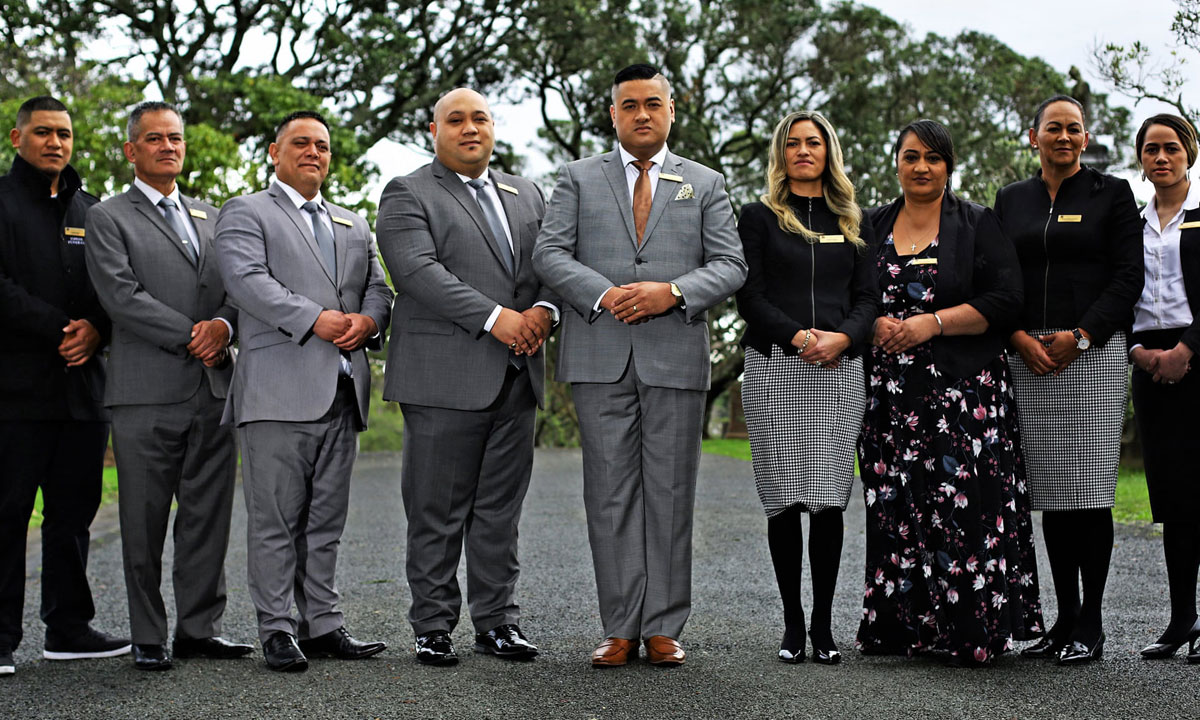 Francis and Kaiora Tipene (centre) with their staff and fellow stars of The Casketeers.