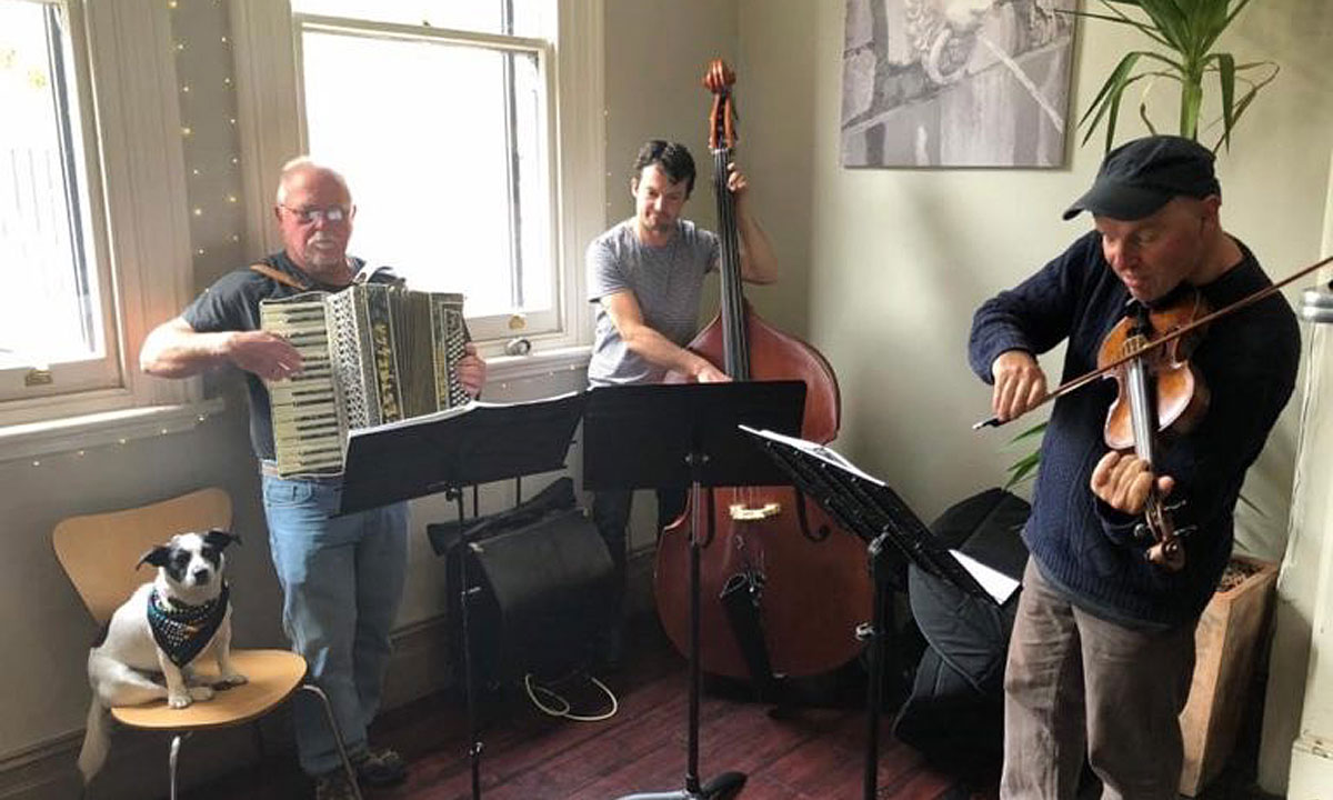Bruce Stewart (far left) with the late David Phillips, Martin Butler and dog Chloe at a gig last year.