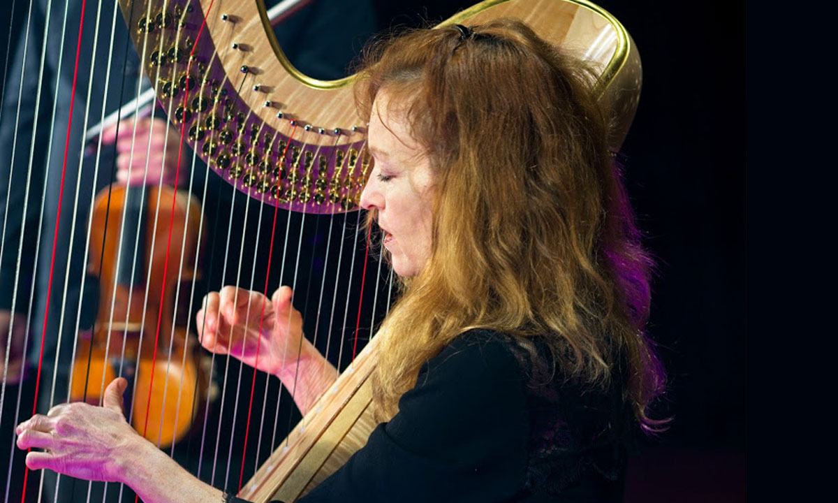 Suzanne Handel playing the ASO's gold harp for the Virtual Concert Hall.