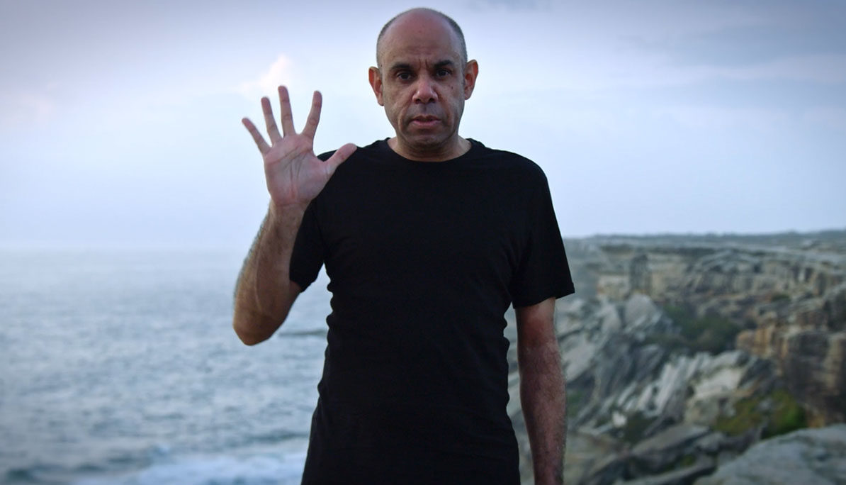 Steven Oliver on location at Kurnell, NSW, in Looky Looky Here Comes Cooky. Photo: SBS
