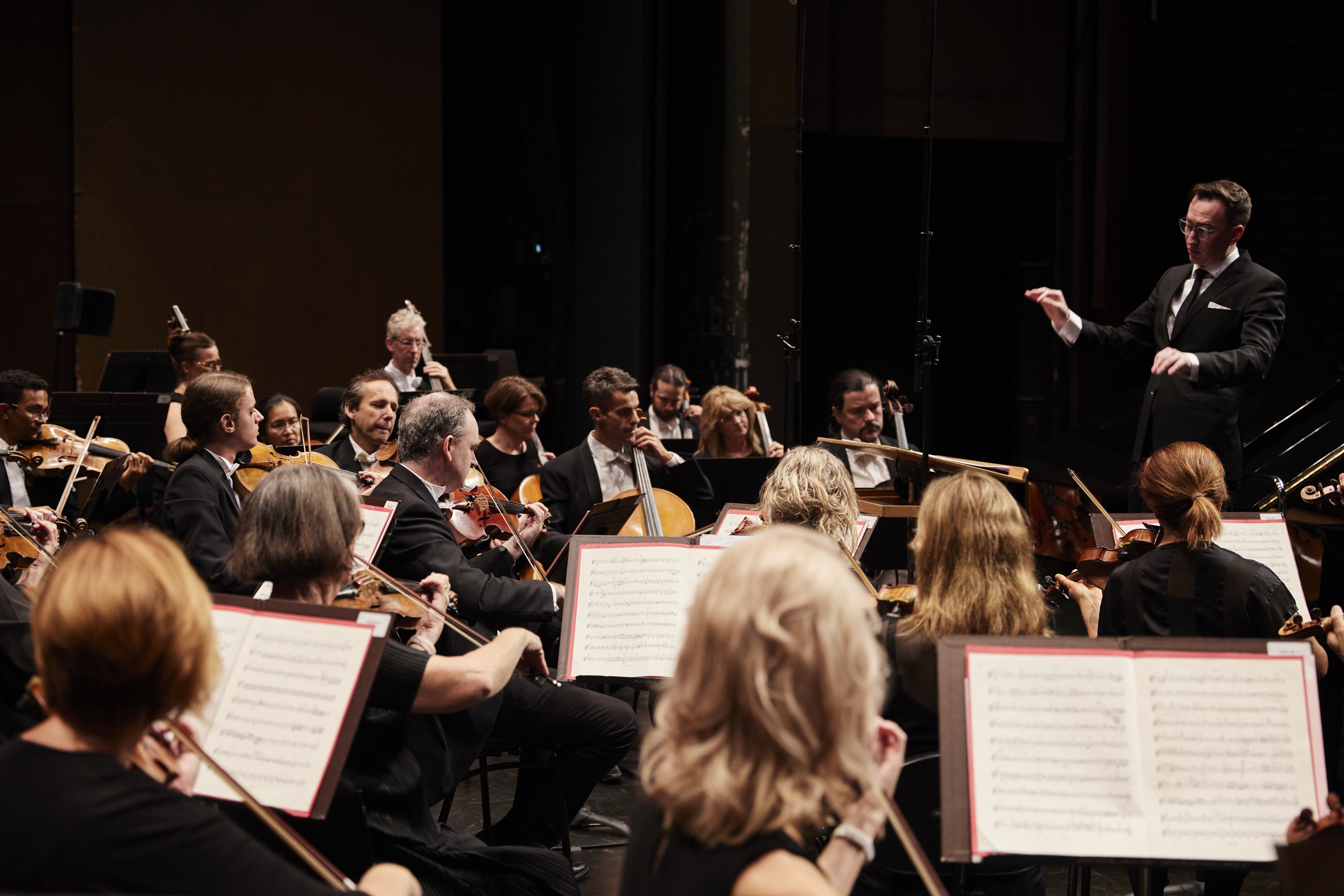Conductor Nathan Aspinall with the ASO. 