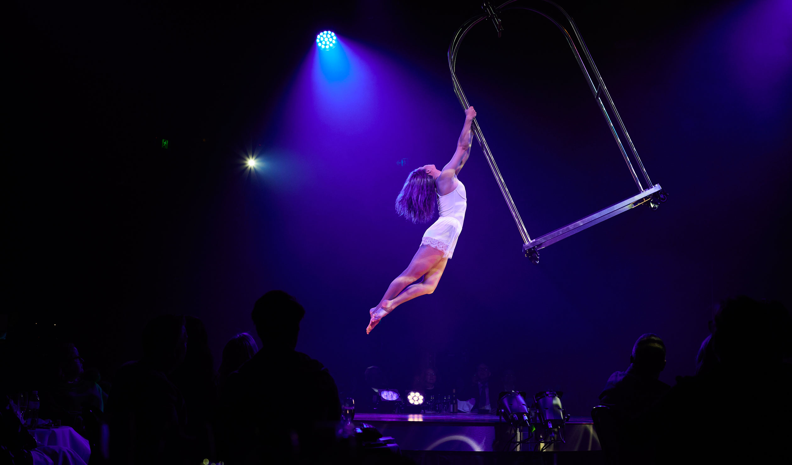 Circus artist Masha Terentieva wows the L'Hotel audience with her performance on a concierge’s cart suspended above them. Photo: Claudio Rashcella