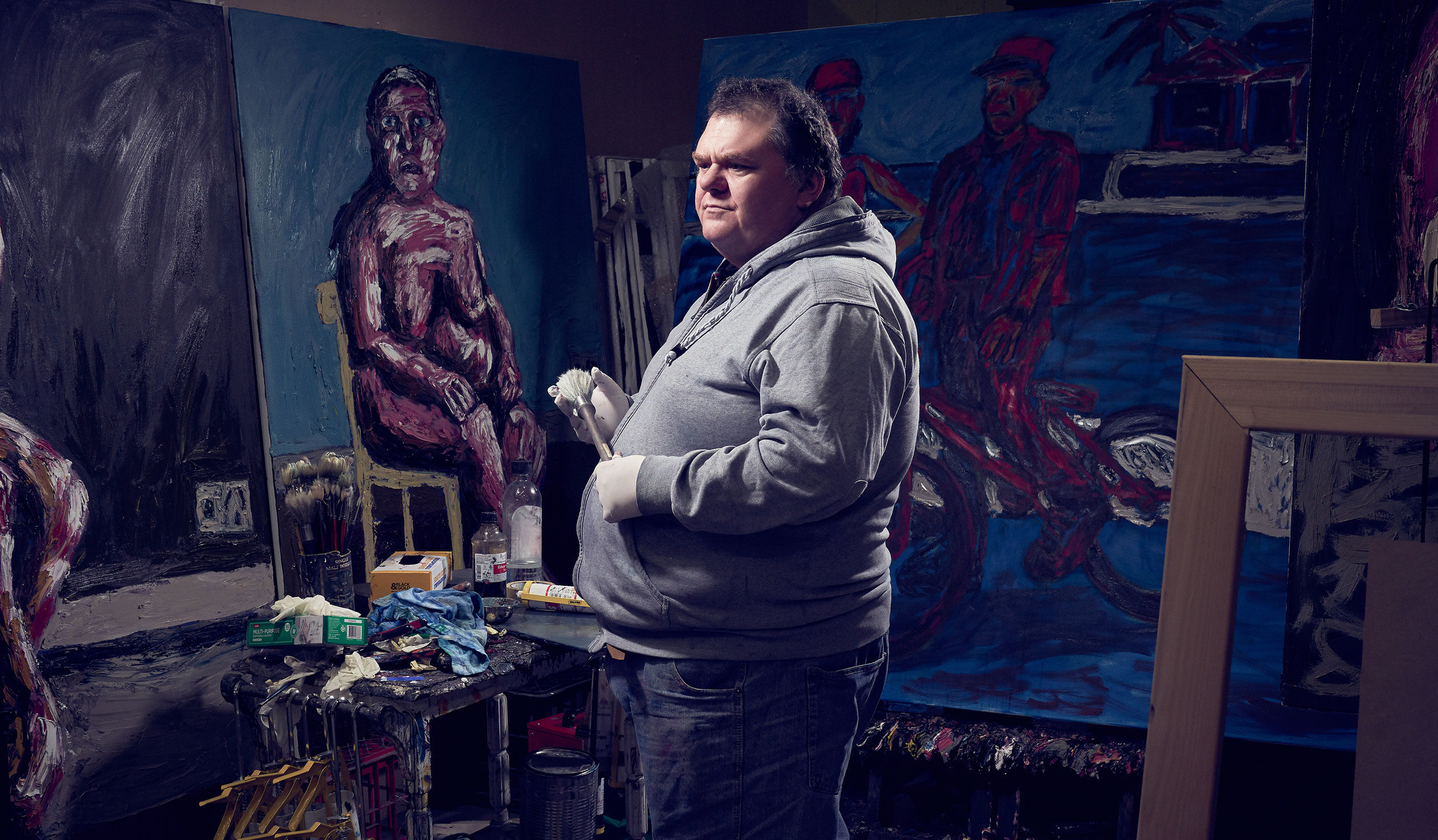 Tom Phillips with some of his latest paintings in his studio at praxis ARTSPACE. Photo: Aubrey Jonsson