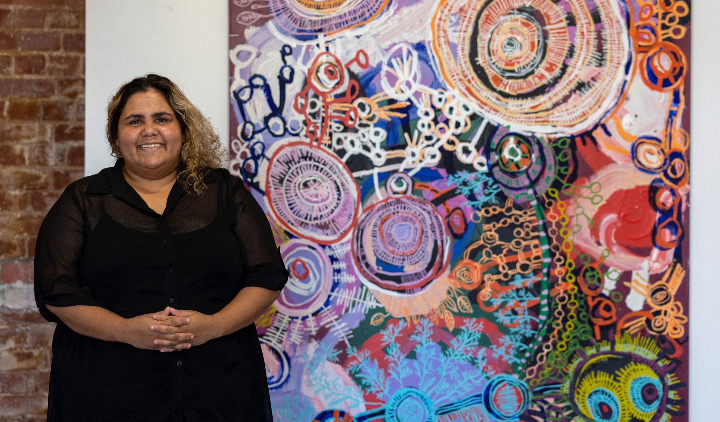 Sally Scales with one of the works in her first exhibition at APY Gallery in Adelaide last year. Photo: Tony Lewis