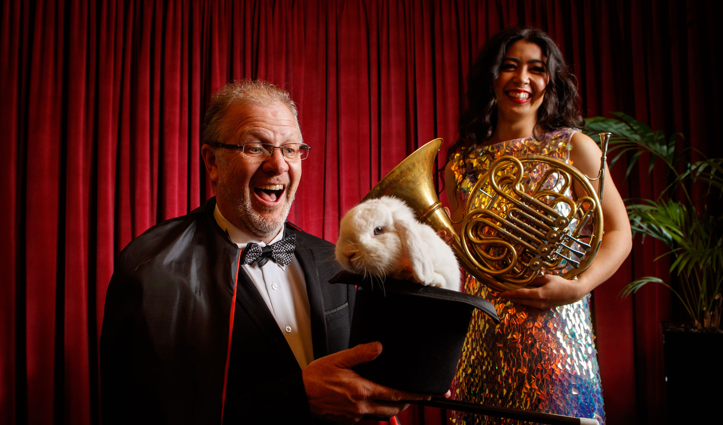 Conductor Guy Noble and French horn player Emma Gregan (pictured with Stanley the rabbit) will work magic with the ASO in 2023. Photo: Matt Turner