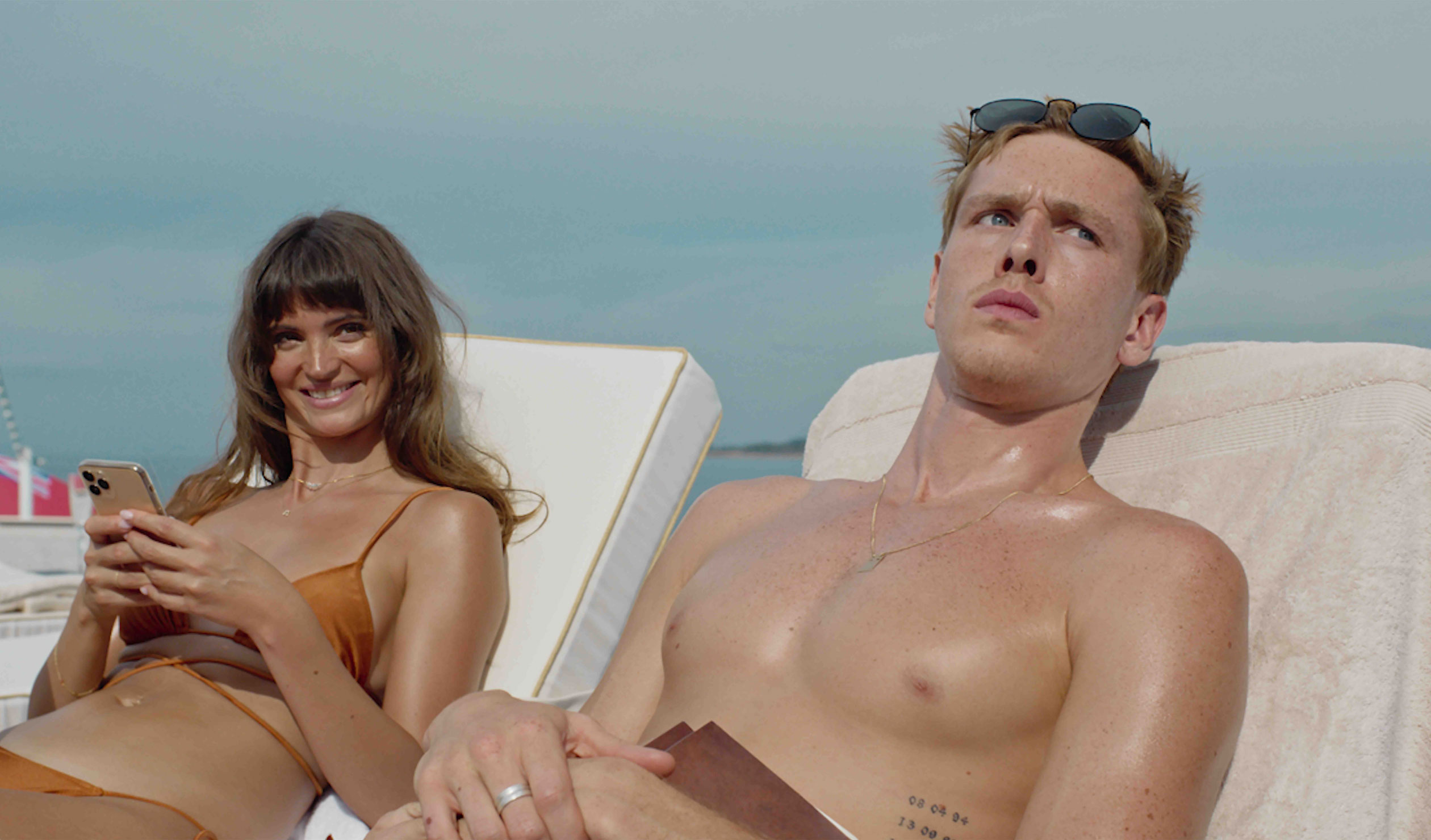 A fashion model celebrity couple are among the passengers on a trouble-plagued cruise for the super-rich in the satire 'Triangle of Sadness'. 