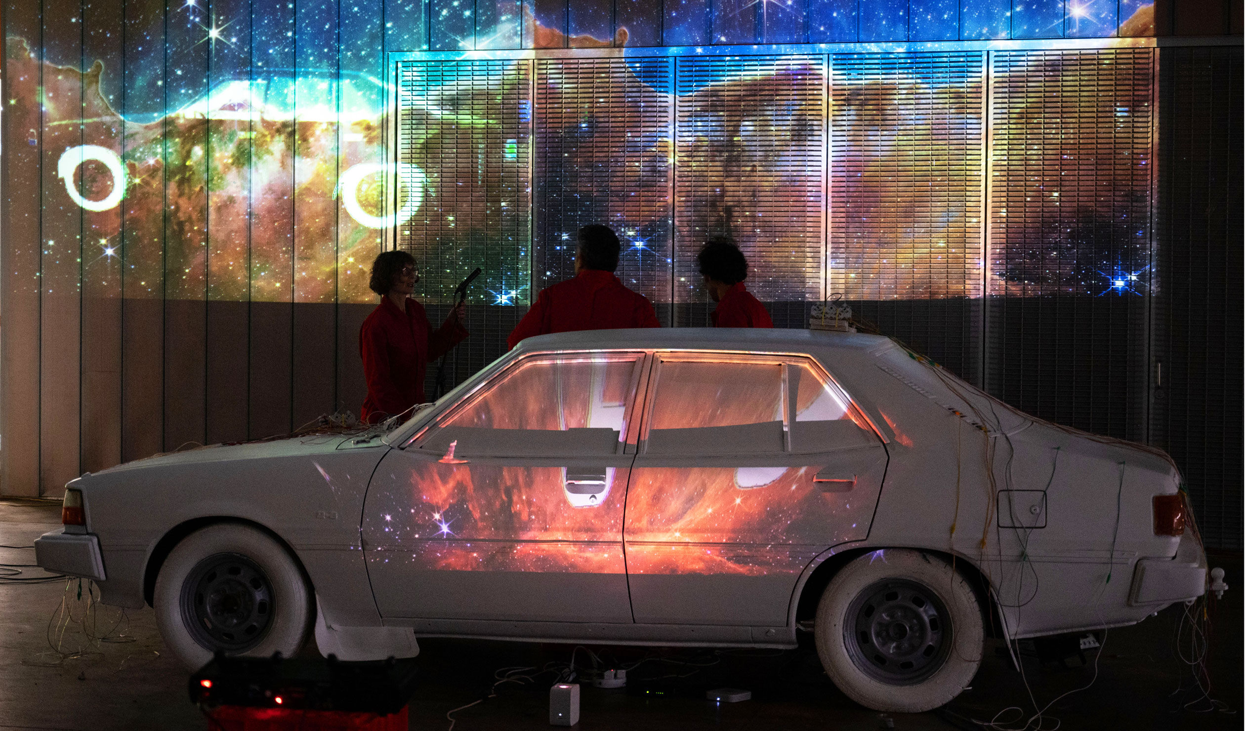 The 'MIDIBISHI' performance at Tonsley features music and projections, all centred on a white-painted 1981 Mitsubishi Sigma. Photos: Kate Zealand