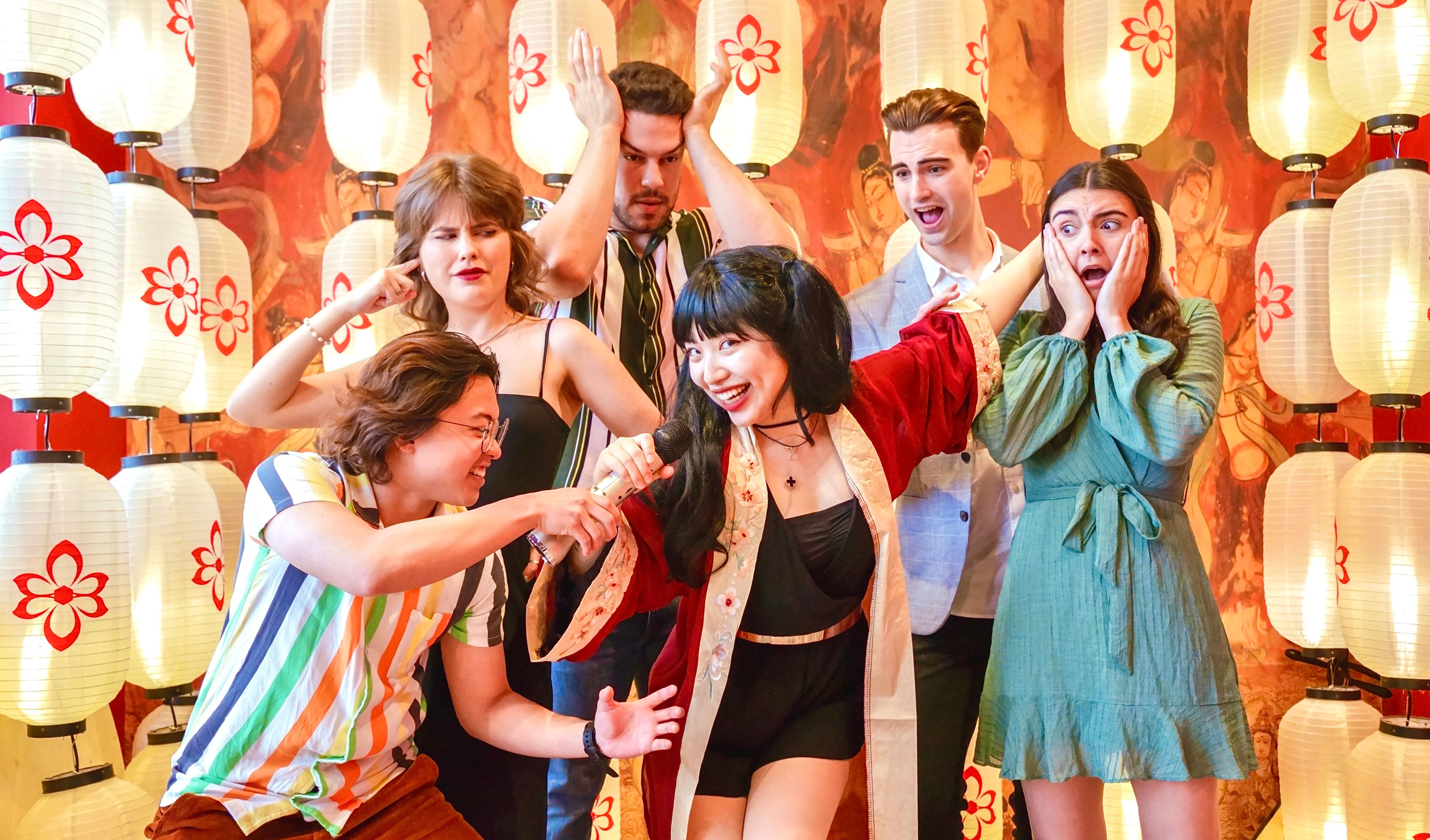 Kira Yang (centre) with Aiden Wang, Darcy Mae, Sasha Simić, Sean Jackson and Jemmah Rattley in a promotional photo for 'Not Your Average Asian Girl'. Photo: Flashing Light Photography Studio