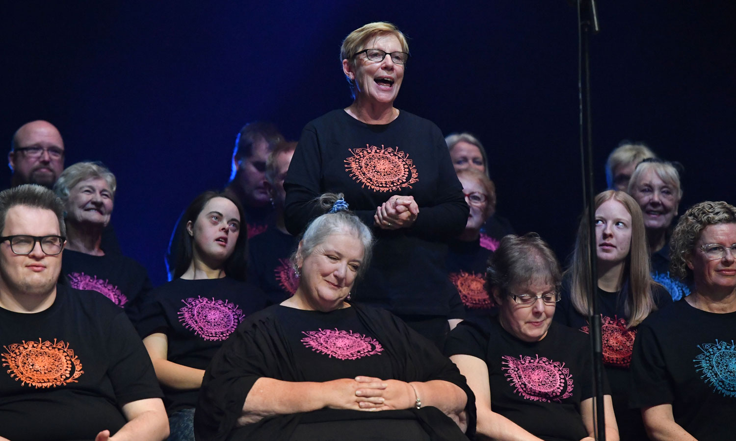 'All voices are welcome': Pat Rix (standing) with the Tutti Choir at the DreamBIG Festival singalong in 2021. Photo: Keryn Stevens 