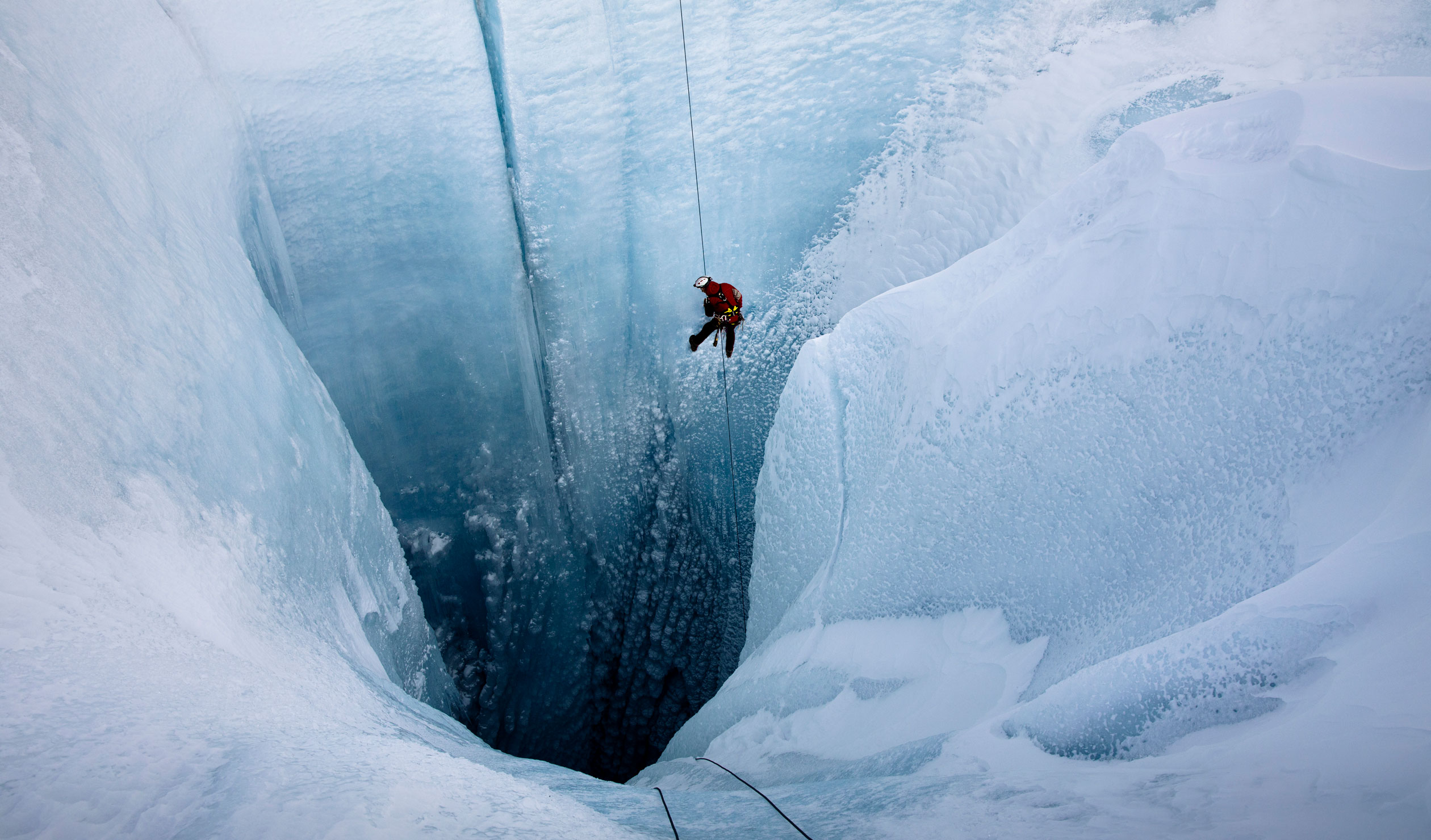 A still from the documentary 'Into the Ice' showing pioneering glaciologist Alun Hubbard on his way into a giant glacier in Greenland. Photo: Lars H Ostenfeld