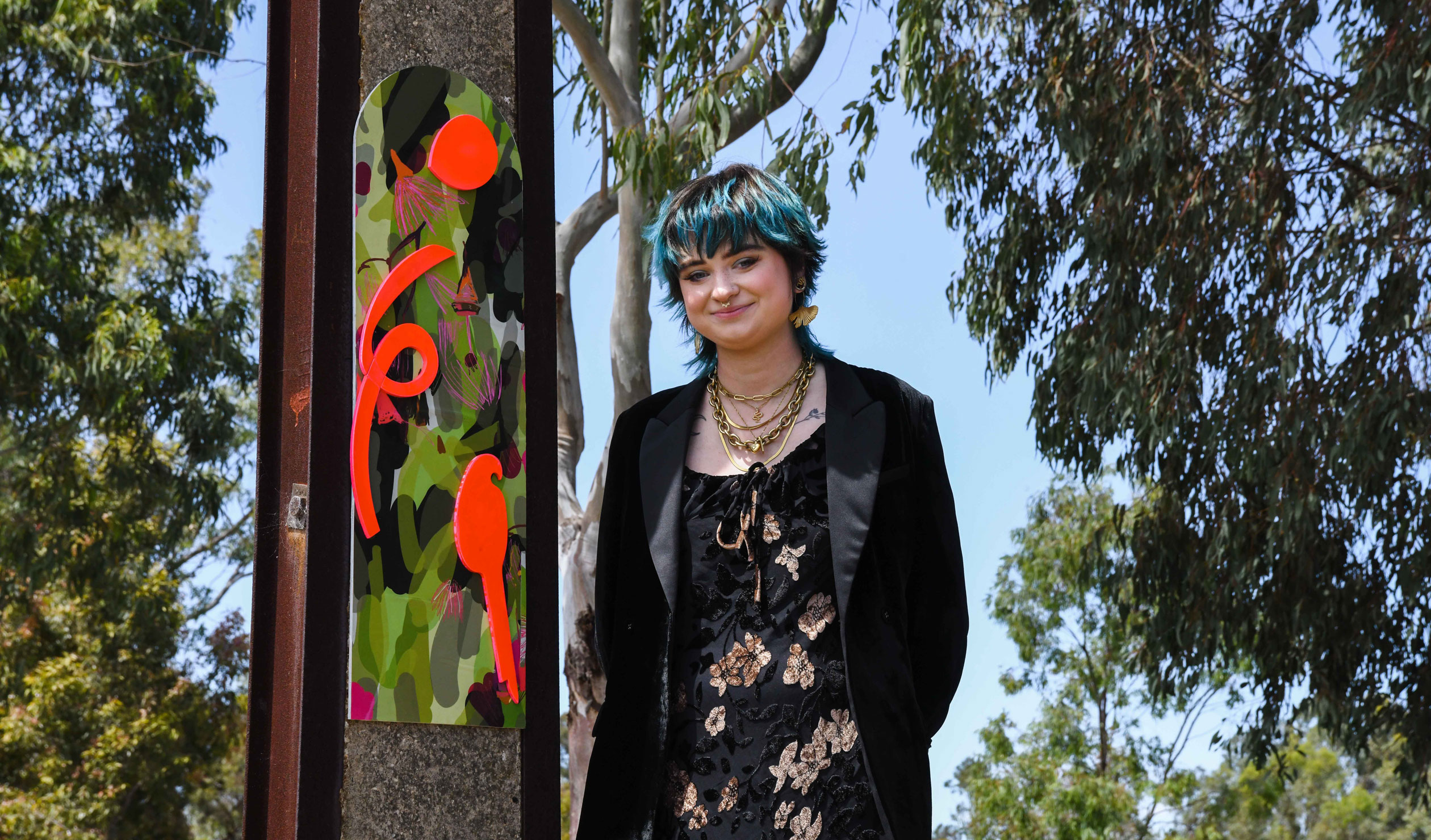 Chloe Noble with one of the Stobie Pole Project works. Photo: Jack Fenby