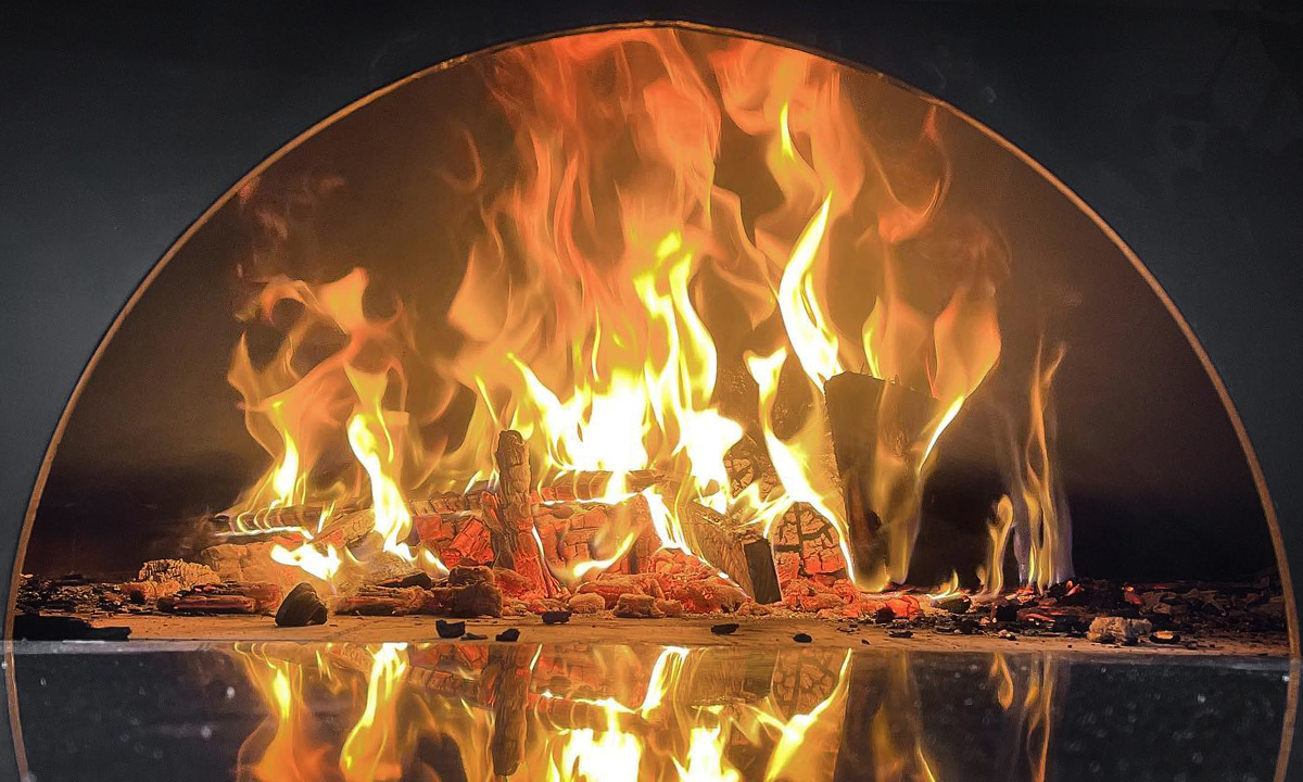A wood-fired oven is at the heart of The Alchemists' Kitchen. Photo: Supplied