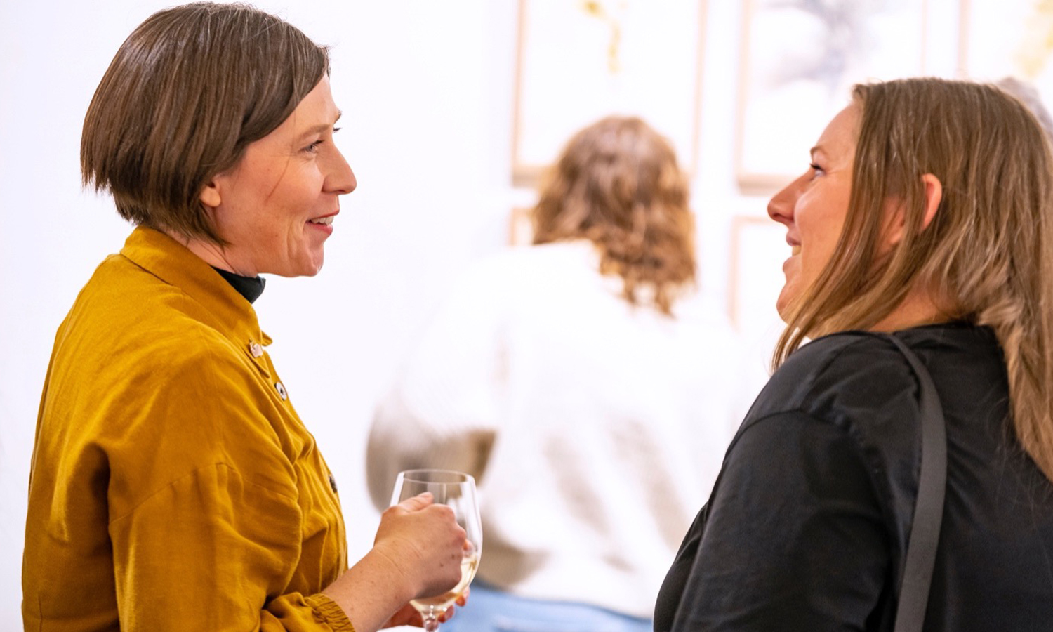 Bridget Currie and Stephanie Doddridge at the opening of Doddridge's 2023 SALA exhibition, 'On Harvesting Dandelions'. Photo: Darren Clements, courtesy the artist.