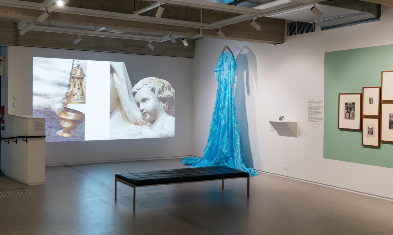 Installation view: The Guildhouse Collections Project: After the Fall, featuring Kate O’Boyle, There’s something about Mary, Mother wound, 2022, digital video, colour, sound, image; PPE COVID gowns, cotton thread, 450.0 x 900.0 cm. Photo: Sia Duff