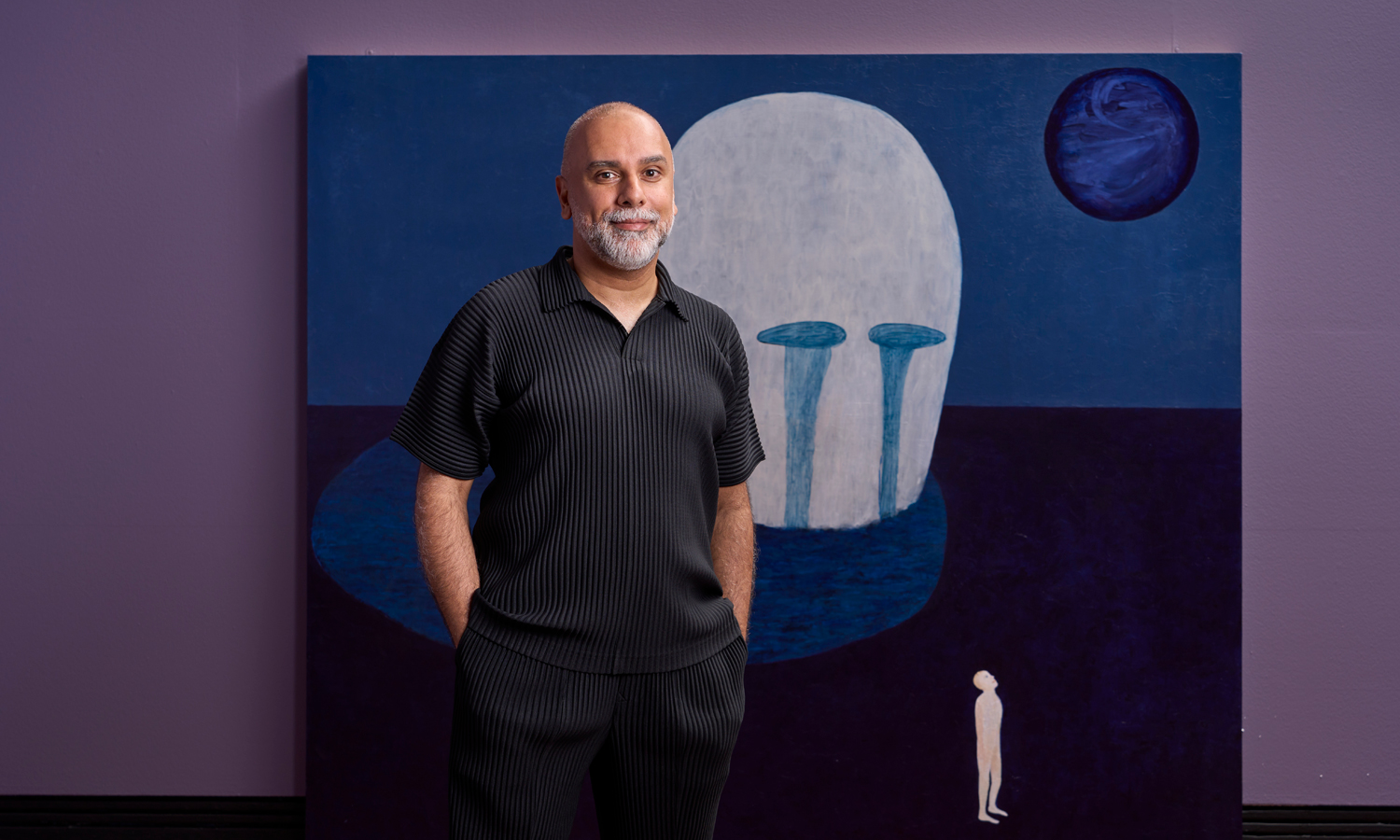 2024 Adelaide Biennial curator José Da Silva in front of a work by Tasmanian artist Heather B Swann. Photo: Sam Roberts / supplied