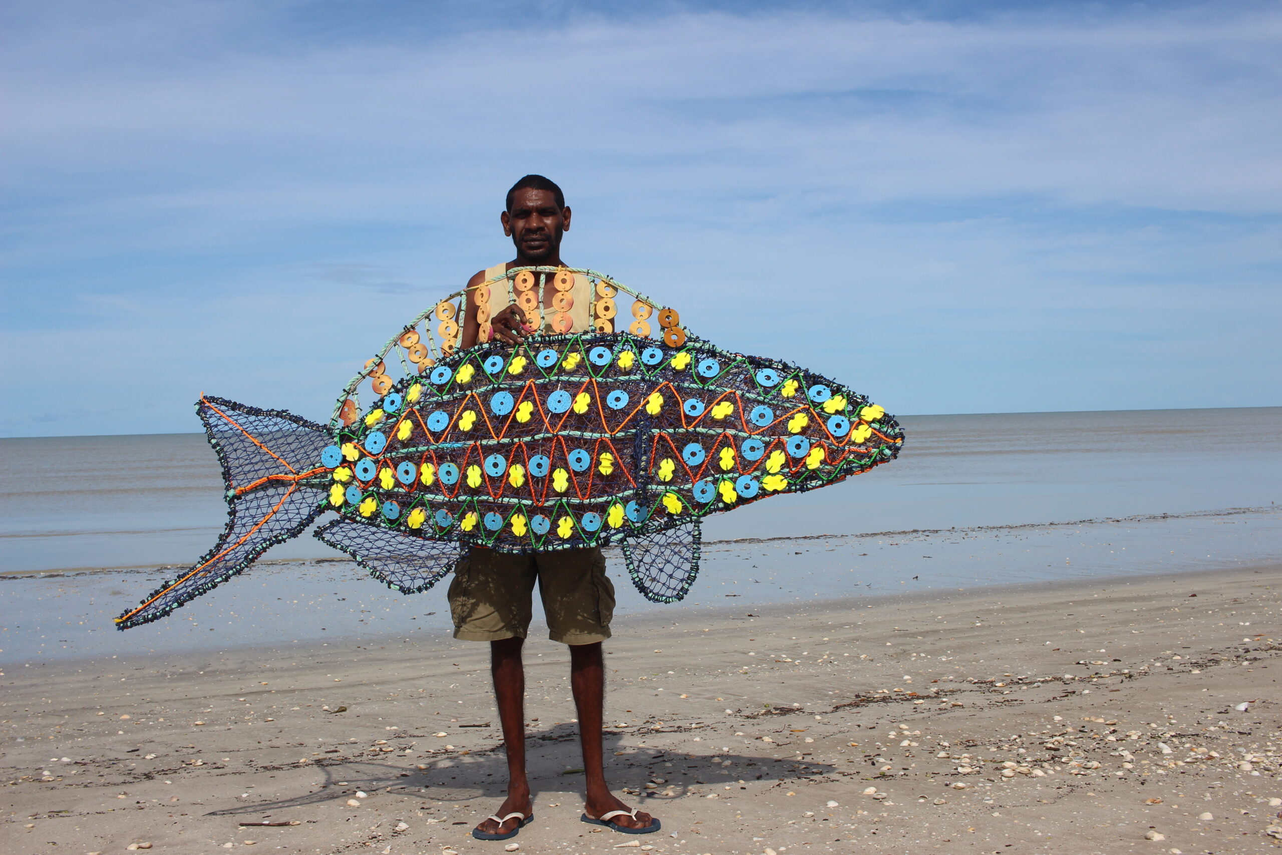 Jones Holroyd from the Pormpuraaw Art and Cultural Centre on Cape York with one of the Ghost Net sculptures that will be showing at World Science Festival Brisbane.