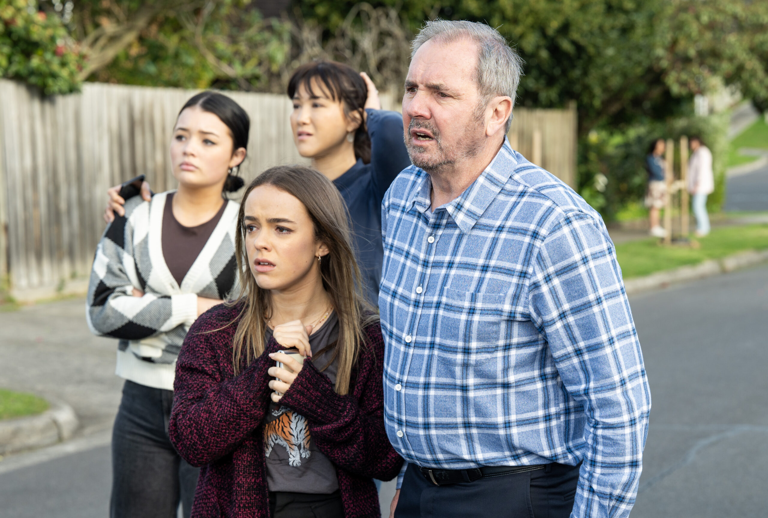 A scene from Neighbours with Sadie Rodwell ( Emerald Chan), Wendy Rodwell (Candice Leask) and Holly Hoyland  (Lucinda Armstrong Hall) and Karl Kennedy (Alan Fletcher). Photo: Ray Messner

