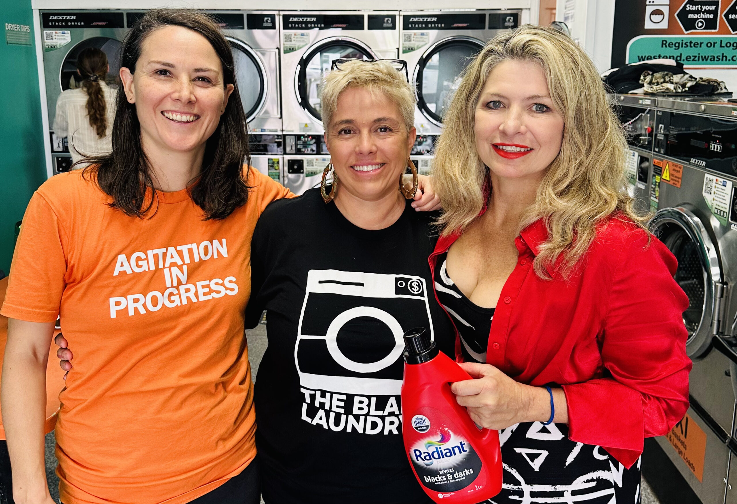 Bec Mac (right) with First Nations artists Libby Harward and Dominique Chen of Blak Laundry, who are building a laundry service that generates income for them and other artists. Photo: Alex MacDonald
 
