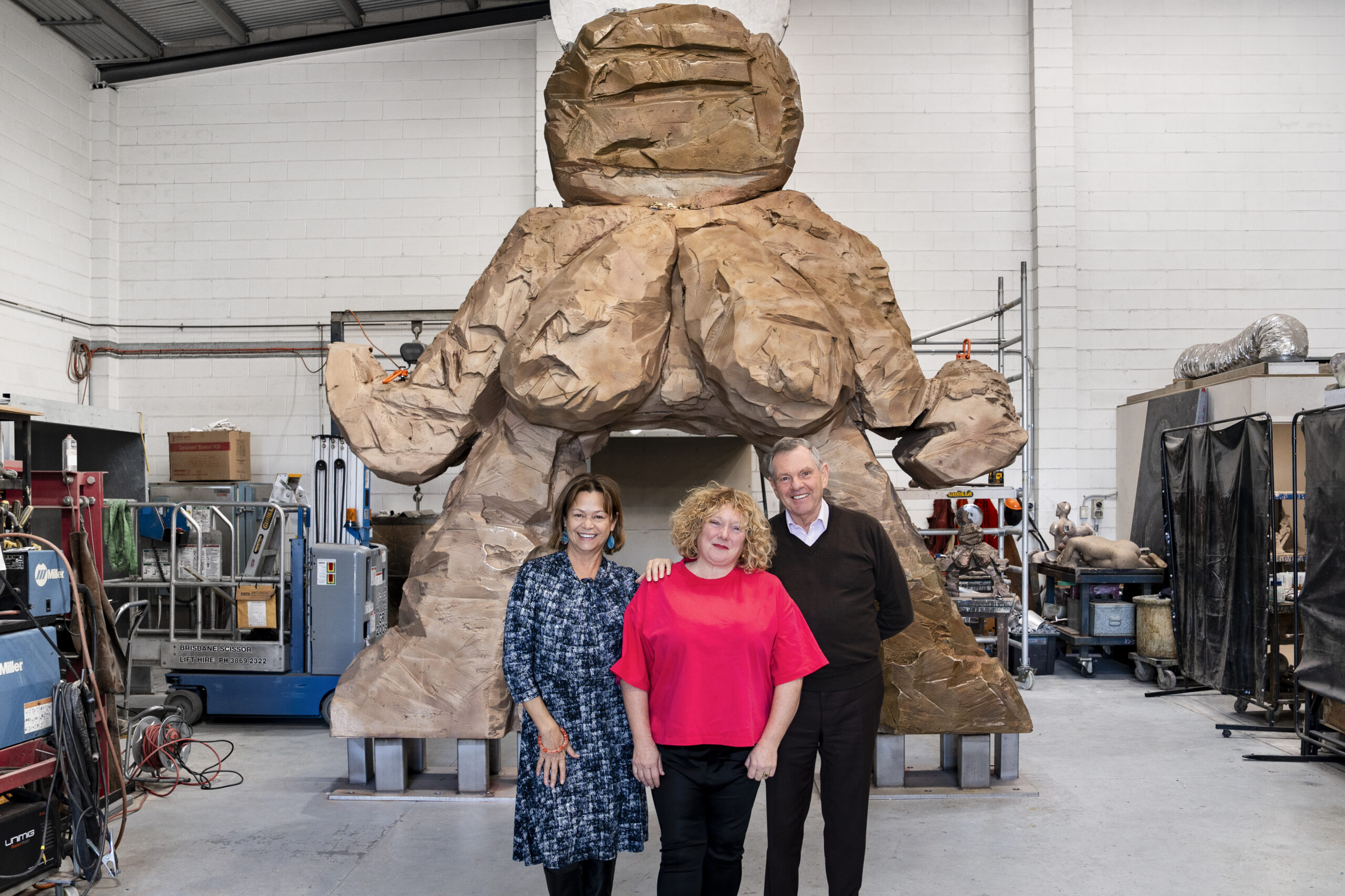 Queen's Wharf Brisbane specialist arts advisory panel members Avril Quaill and Philip Bacon with artist Justene Williams (centre) and her major sculpture Sheila at Piperides Art Foundry in Geebung, Brisbane. Photo by Louis Lim