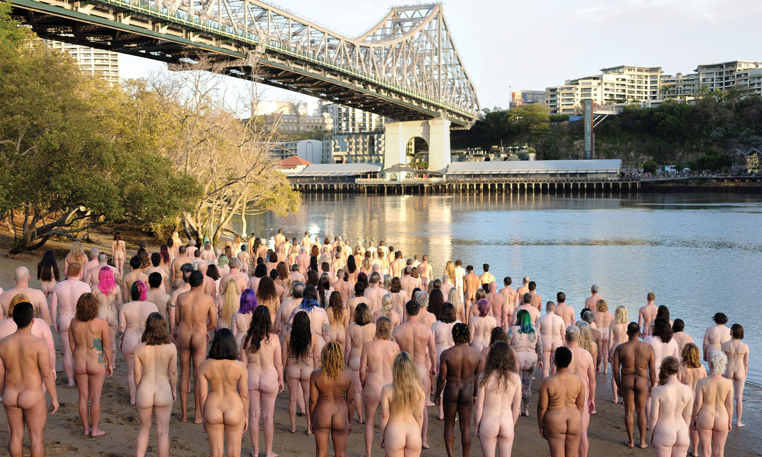 Nude locals pose for Spencer Tunick's work TIDE in late 2023, but for his next shoot in October everyone will be on the Story Bridge.
