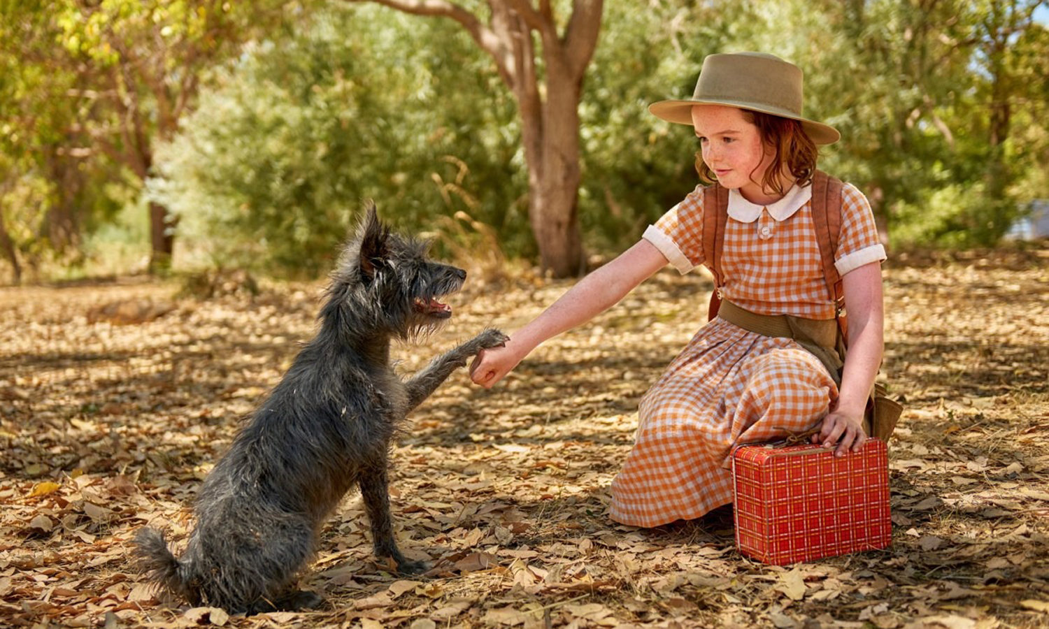 Lilly LaTorre as Annie with her loyal friend Runt (Squid). Photo: Court McAllister / Studio Canal
